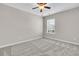 Neutral bedroom featuring a ceiling fan, plush carpet, and a window for natural light at 105 Endicott Ct, Summerville, SC 29486