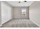 Neutral bedroom features a ceiling fan, plush carpet, a double door closet, and a window at 105 Endicott Ct, Summerville, SC 29486