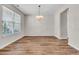 Bright dining room features hardwood floors, modern chandelier lighting, and neutral paint at 105 Endicott Ct, Summerville, SC 29486