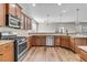 Open kitchen featuring granite countertops, stainless steel appliances, and wood cabinetry at 105 Endicott Ct, Summerville, SC 29486