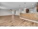 Open-concept living room and kitchen area with hardwood floors and modern lighting at 105 Endicott Ct, Summerville, SC 29486