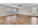 Living room featuring hardwood floors, ceiling fan, and multiple windows at 105 Endicott Ct, Summerville, SC 29486