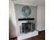 Charming fireplace with whitewashed brick, decorative accents, and a cozy ambiance for relaxing evenings at 106 Shirley Dr, Ladson, SC 29456