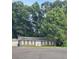 Charming single-story brick home nestled among lush trees at 106 Shirley Dr, Ladson, SC 29456