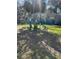 Community dog park offering waste disposal stations, beautiful green space, and natural shady trees at 1142 Village Creek Ln # 3, Mount Pleasant, SC 29464