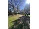 Community green space with a picnic table set amongst mature shade trees at 1142 Village Creek Ln # 3, Mount Pleasant, SC 29464