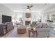 Open-concept living room featuring natural light, fireplace, ceiling fan and comfortable seating at 1142 Village Creek Ln # 3, Mount Pleasant, SC 29464