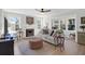 Inviting living room featuring a fireplace, large windows, and stylish décor at 1142 Village Creek Ln # 3, Mount Pleasant, SC 29464