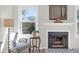 Cozy living room area featuring a fireplace, hardwood floors, and natural light at 1142 Village Creek Ln # 3, Mount Pleasant, SC 29464