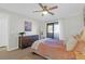 Spacious main bedroom featuring a ceiling fan, private balcony and warm lighting at 1142 Village Creek Ln # 3, Mount Pleasant, SC 29464