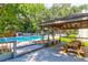 Community pool area featuring a pergola with seating and mature shade trees at 1142 Village Creek Ln # 3, Mount Pleasant, SC 29464