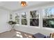 Bright sunroom featuring three large windows and a view of the outdoors at 1142 Village Creek Ln # 3, Mount Pleasant, SC 29464