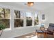 Bright sunroom featuring three large windows, offering lots of natural light and views of the outdoors at 1142 Village Creek Ln # 3, Mount Pleasant, SC 29464
