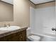 Bathroom featuring single sink vanity and a shower-tub combination at 116 Wisteria Falls Trl, Saint Stephen, SC 29479