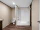 A clean bathroom features a tub-shower, toilet, vinyl flooring and vanity at 116 Wisteria Falls Trl, Saint Stephen, SC 29479