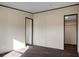 Bedroom featuring dark wood-look floors with a closet at 116 Wisteria Falls Trl, Saint Stephen, SC 29479