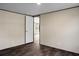 Bedroom featuring dark wood-look floors and a doorway to another room at 116 Wisteria Falls Trl, Saint Stephen, SC 29479