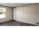 Bedroom boasts dark wood-look floors and a window with a view at 116 Wisteria Falls Trl, Saint Stephen, SC 29479