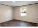 Bedroom boasts dark wood-look floors and a window with a view at 116 Wisteria Falls Trl, Saint Stephen, SC 29479