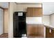 Bright kitchen features stainless steel appliances, ample counter space, and wood-look laminate flooring at 116 Wisteria Falls Trl, Saint Stephen, SC 29479