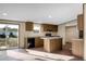 Modern kitchen featuring wood cabinets, an island with stone countertops, and stainless steel appliances, designed for cooking at 116 Wisteria Falls Trl, Saint Stephen, SC 29479