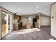 Bright kitchen with wood cabinets, an island with stone countertops, and a sliding glass door offering easy outdoor access at 116 Wisteria Falls Trl, Saint Stephen, SC 29479
