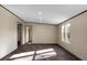 Bright and open living area has wood-look floors and large windows, perfect for entertaining or relaxing at 116 Wisteria Falls Trl, Saint Stephen, SC 29479