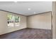 Relaxing living room with wood flooring and large windows offering views of the natural landscape, promoting relaxation at 116 Wisteria Falls Trl, Saint Stephen, SC 29479