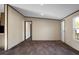 A bright living room with light-colored walls, dark trim and vinyl floors offers a welcoming space at 116 Wisteria Falls Trl, Saint Stephen, SC 29479