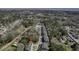 An aerial view of a neighborhood showcasing the layout, surrounding trees, and community pond at 1204 Dingle Rd, Mount Pleasant, SC 29466