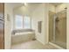 Bright bathroom featuring a soaking tub and a glass enclosed shower at 1204 Dingle Rd, Mount Pleasant, SC 29466