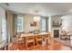Well-lit dining room featuring a chandelier, fireplace, and a view into the living room at 1204 Dingle Rd, Mount Pleasant, SC 29466