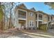 Back exterior view of home showcasing the screened porch and well-maintained landscaping at 1204 Dingle Rd, Mount Pleasant, SC 29466