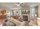 Inviting living room featuring a fireplace, ceiling fan, dining area, and stylish decor at 1204 Dingle Rd, Mount Pleasant, SC 29466