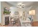 Cozy living room with a fireplace, ceiling fan, plush sofas, and a decorative rug at 1204 Dingle Rd, Mount Pleasant, SC 29466