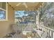 Cozy screened porch with seating, a ceiling fan, and views of the surrounding nature at 1204 Dingle Rd, Mount Pleasant, SC 29466