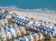 Coastal homes are nestled between lush greenery and the beautiful oceanfront at 129 Grand Pavilion Blvd, Isle of Palms, SC 29451