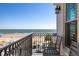Relaxing balcony view of ocean and beach, complete with outdoor seating at 129 Grand Pavilion Blvd, Isle of Palms, SC 29451