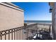 Balcony view of ocean, beach and pool, with outdoor seating at 129 Grand Pavilion Blvd, Isle of Palms, SC 29451