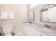 Elegant bathroom featuring dual sinks, white marble countertops, and modern fixtures, offering a spa-like experience at 129 Grand Pavilion Blvd, Isle of Palms, SC 29451