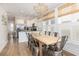 Inviting dining area with a wooden table, white cabinets and stainless steel appliances at 129 Grand Pavilion Blvd, Isle of Palms, SC 29451