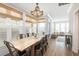 Dining room features a wooden table, unique light fixture and plenty of natural light at 129 Grand Pavilion Blvd, Isle of Palms, SC 29451
