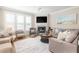 Inviting living room with fireplace, TV, and plenty of seating, creating a cozy atmosphere at 129 Grand Pavilion Blvd, Isle of Palms, SC 29451