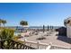 Relaxing pool deck area with lots of seating and partial view of the ocean in a beachfront resort at 129 Grand Pavilion Blvd, Isle of Palms, SC 29451