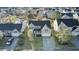 Aerial view of the house and landscaped front yard in a residential neighborhood with mature trees at 138 Back Tee Cir, Summerville, SC 29485