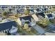 Overhead angle of house with landscaped front yard in a residential neighborhood with mature trees and backyard pond at 138 Back Tee Cir, Summerville, SC 29485