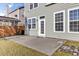 Well maintained backyard with a gray house, and concrete patio at 138 Back Tee Cir, Summerville, SC 29485
