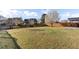 Large, fenced backyard with lush grass and mature tree providing privacy and space for outdoor activities at 138 Back Tee Cir, Summerville, SC 29485