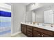 Bathroom featuring a double sink vanity with dark wood cabinetry at 138 Back Tee Cir, Summerville, SC 29485