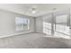 A view of a bright bedroom featuring windows and a ceiling fan at 138 Back Tee Cir, Summerville, SC 29485